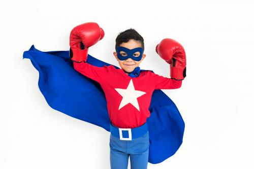 Superhero boy wearing a pear of boxing gloves - 6764