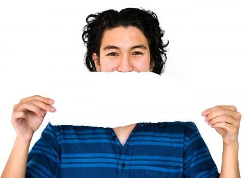 Young adult asian man holding blank paper cover his mouth - 6290