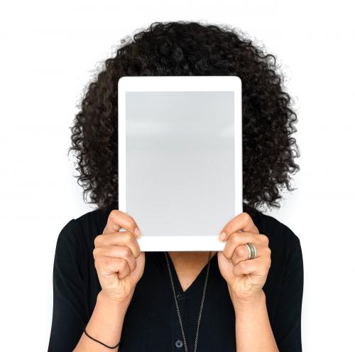 Woman holding tablet covering her face - 6304