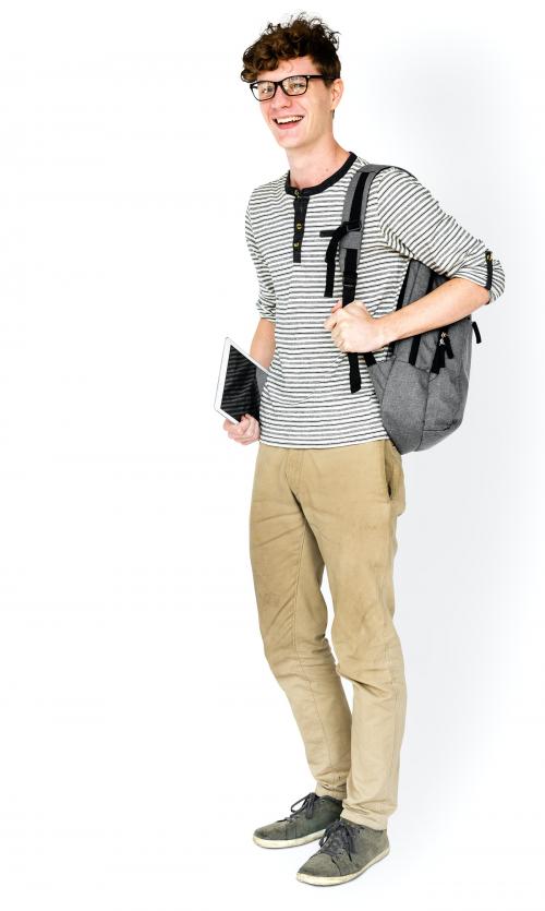 Caucasian young man standing with backpack and tablet - 5173