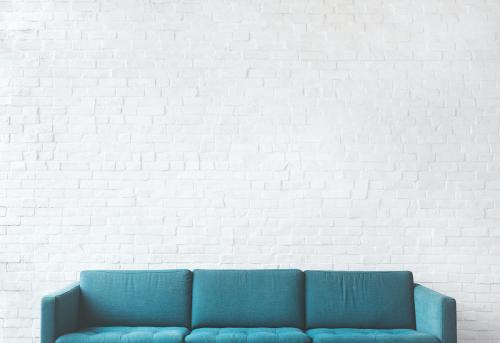 Teal couch on a mockup brick wall - 5493