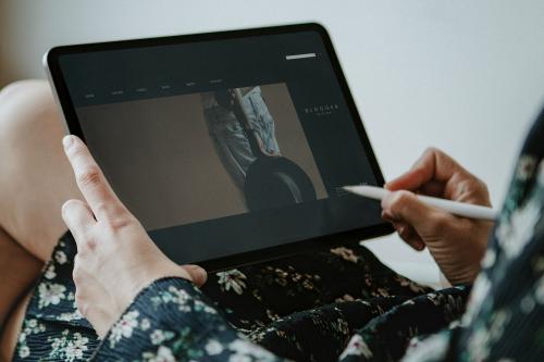 Woman blogging on a digital tablet mockup - 1213866