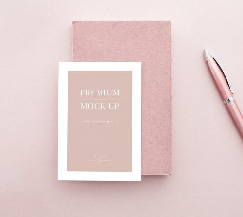 White card mockup on a pastel pink table - 1215137