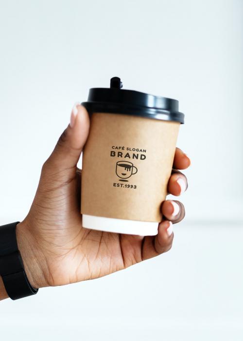 Black woman holding a paper coffee cup mockup - 1209071