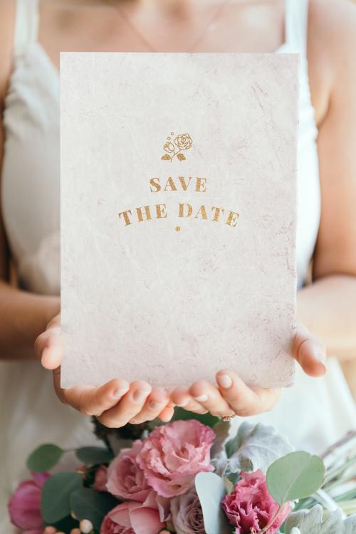 Bride holding a save the date card mockup - 1210007