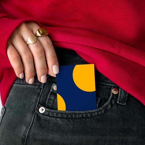Woman keeping a card in a pocket of her jeans - 2287426