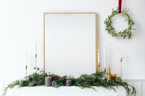 Festive golden photo frame against a white wall - 1231306