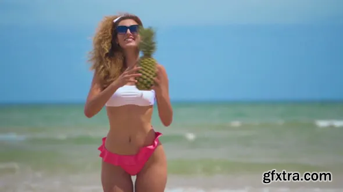 Videohive Funny Smiling Girl in Summer Swimwear and Sunsunglasses. Sexy Woman with Fresh Pineapple. Positive 24001077