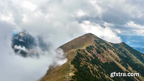 Videohive Clouds Moving Fast in Mountains in Alps Landscape 24765733