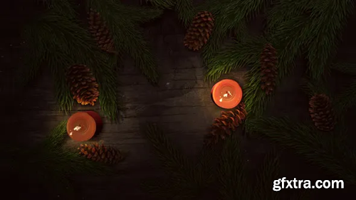 Videohive Animated close up Christmas candle and green tree branches on wood background 29403823