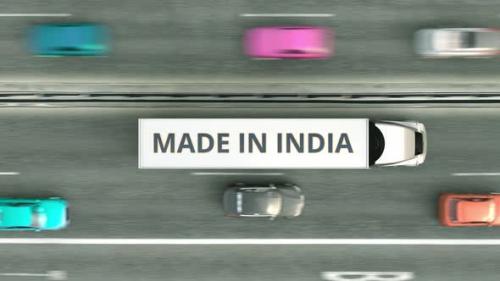 Videohive - Trailer Trucks with MADE IN INDIA Text Driving Along the Road - 32332362