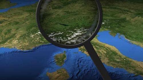 Videohive - Magnifying Glass Finds Genoa City on the Map - 32356443