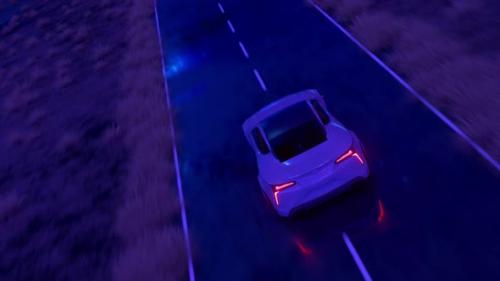 Videohive - The Car Rushes at Fast Speed Along the Asphalt Road Along the Desert Into a Fabulous Sunset with a - 32441942