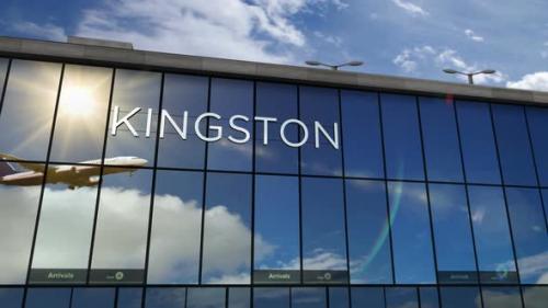 Videohive - Airplane landing at Kingston Jamaica airport mirrored in terminal - 32487788