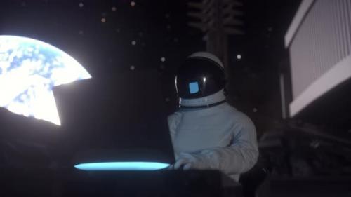 Videohive - Astronaut Works on His Science Laptop in a Space Colony on the Moon - 32892371
