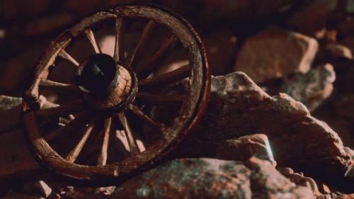 Videohive - Old Wooden Wheel on Rocks - 32989211