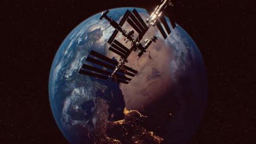 Videohive - International Space Station in Outer Space Over the Planet Earth Orbit - 33100180