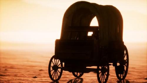 Videohive - Canvas Covered Retro Wagon in Desert at Sunset - 33152843