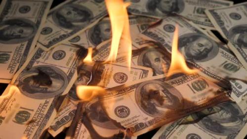 Videohive - Slow Motion of Dollars Money on Fire Lost Money - 33136622