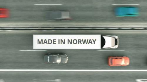 Videohive - Trucks with MADE IN NORWAY Text Driving Along the Highway - 33285052
