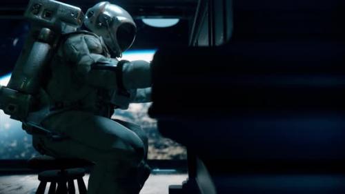 Videohive - Astranaut in a Spacesuit Plays the Piano in a Spaceship Overlooking the Planet Earth - 33671825