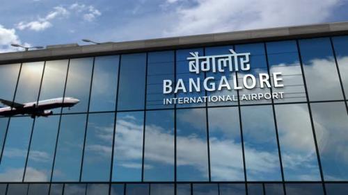 Videohive - Airplane landing at Bangalore India airport mirrored in terminal - 33710401