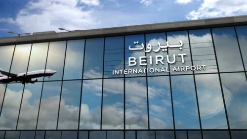 Videohive - Airplane landing at Beirut Lebanon airport mirrored in terminal - 33848126