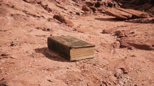 Videohive - Old Book in Red Rock Desert - 34136972