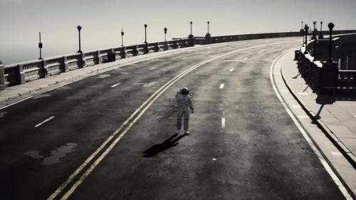 Videohive - Astronaut Walks in the Middle of a Road - 34519700