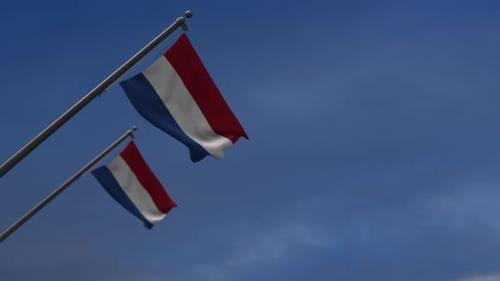 Videohive - Netherlands Flags In The Blue Sky - 4K - 34532810