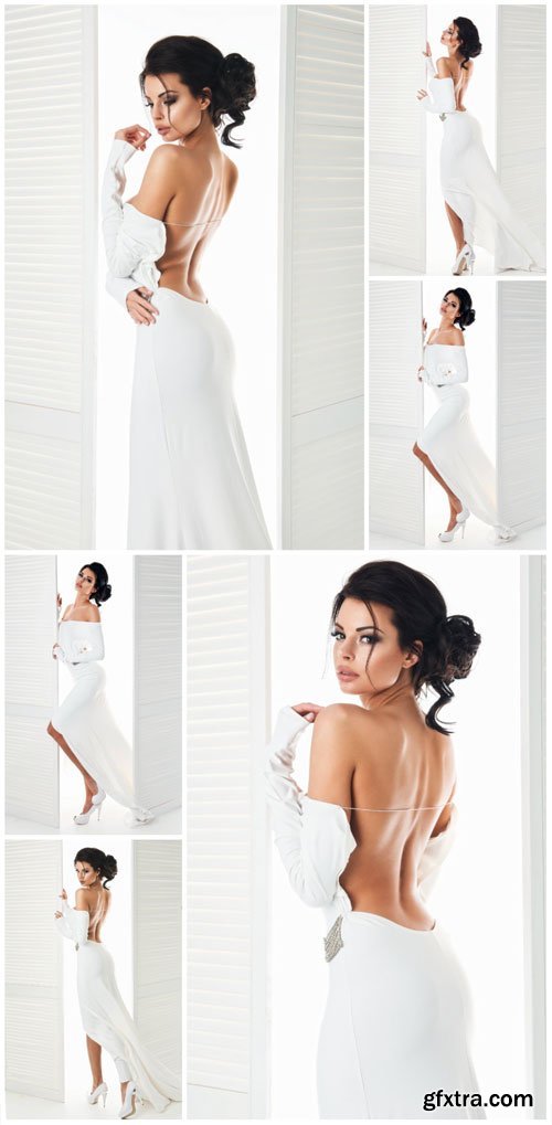 Charming girl in a long white dress