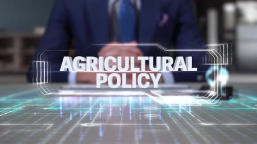 Videohive - Businessman Writing On Hologram Table Economics Word Agricultural Policy - 35164890