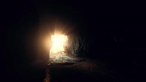 Videohive - Breathtaking Scenery of Bright Sun Rays Falling Inside a Cave Illuminating - 35366946
