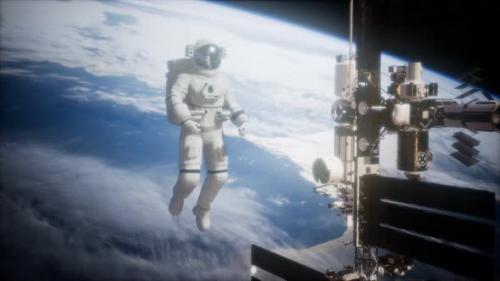 Videohive - International Space Station and Astronaut in Outer Space Over the Planet Earth - 35536148
