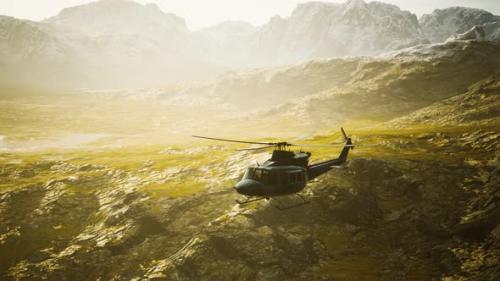 Videohive - Slow Motion Vietnam War Era Helicopter in Mountains - 36343472