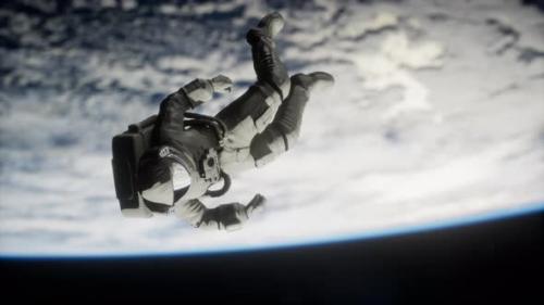 Videohive - Astronaut Floating Above the Earth Elements of This Image Furnished By NASA - 36679566