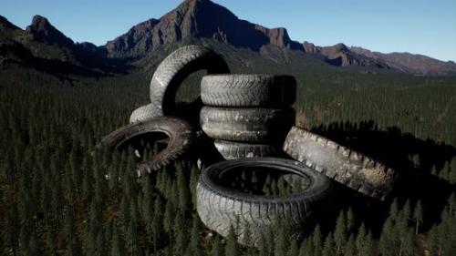 Videohive - Concept of Environmental Pollution with Big Old Tires in Mountain Forest - 36736342