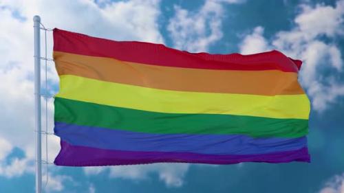 Videohive - Rainbow LGBT Flag Waving Against a Blue Sky - 38993505