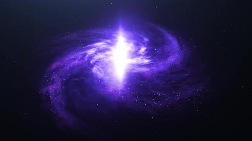 Videohive - A spiral galaxy in the dark starry sky. The camera slowly zooms in on the purple galaxy. - 39602631