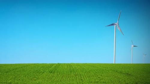 Videohive - 3d Animation of Windmills on a sown field. Concept of eolic clean and renewable energy from the wind - 43001867