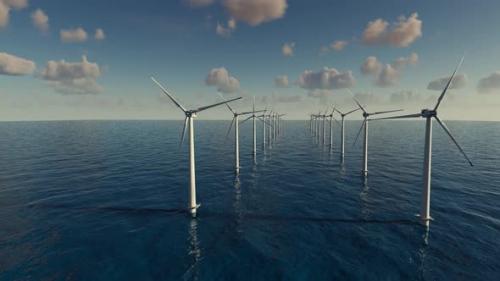 Videohive - Large wind turbines generating electricity on the sea of a beautiful sunset and clouds. - 43220444