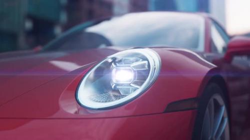 Videohive - red car close-up shines headlights in urban environment camera movement with Dolly Zoom effect - 43405412