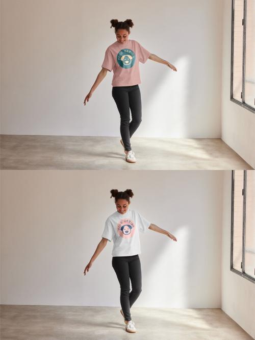 Mockup of woman wearing t-shirt with customizable color, standing with arms out 637254649