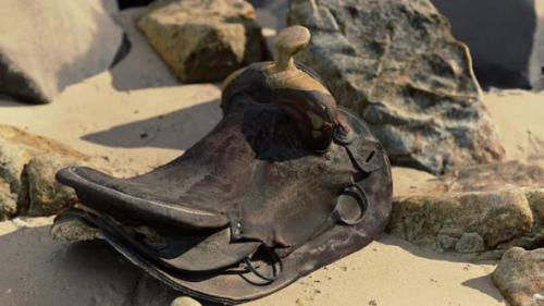 Videohive - Very Old Horse Saddle on Sand Beach - 47639760