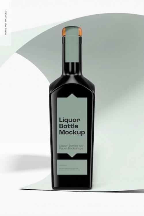 Premium PSD | Liquor bottle with paper backdrop mockup, front view Premium PSD