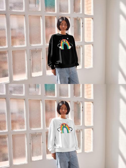 Mockup of Asian woman wearing sweatshirt with customizable color leaning with back on window 640128163
