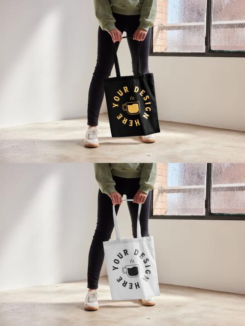 Mockup of woman standing holding customizable tote bag, low section 640127293