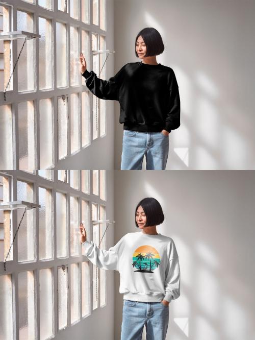 Mockup of Asian woman wearing customizable color sweatshirt touching window 649154481