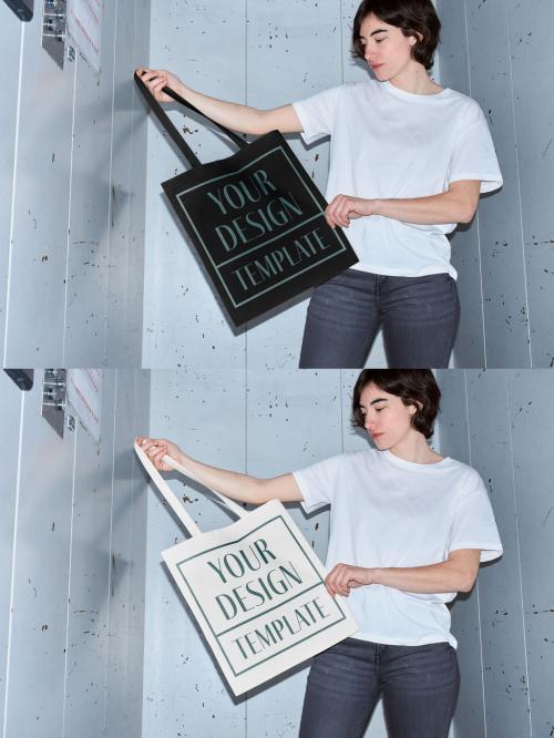 Mockup of woman holding customizable tote bag in elevator, camera flash 649149689