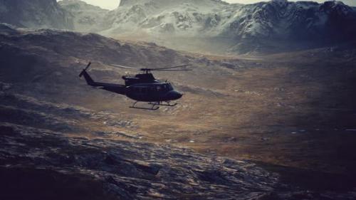 Videohive - Slow Motion Vietnam War Era Helicopter in Mountains - 48098372